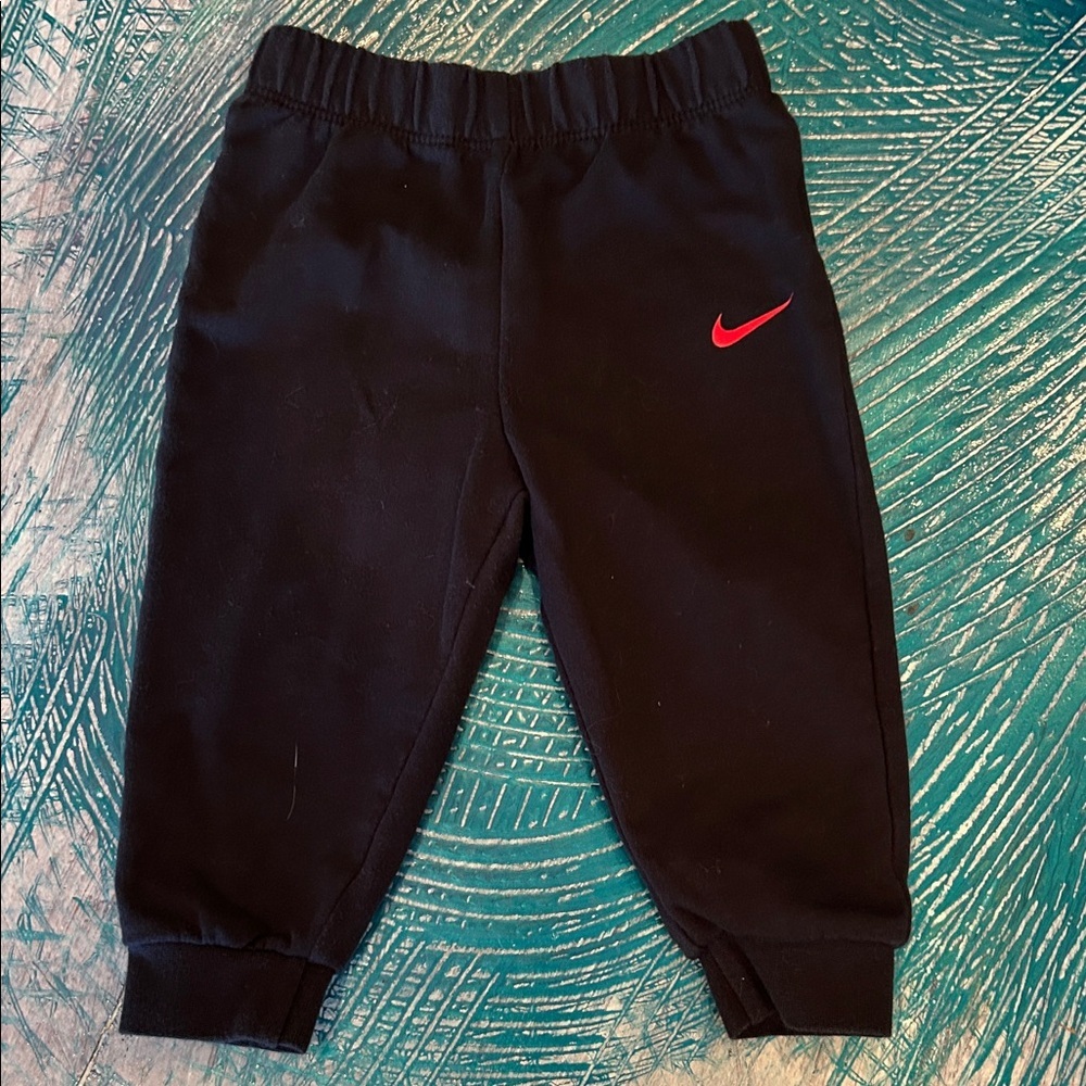 Nike Kids Black Sweatpants with Red Logo